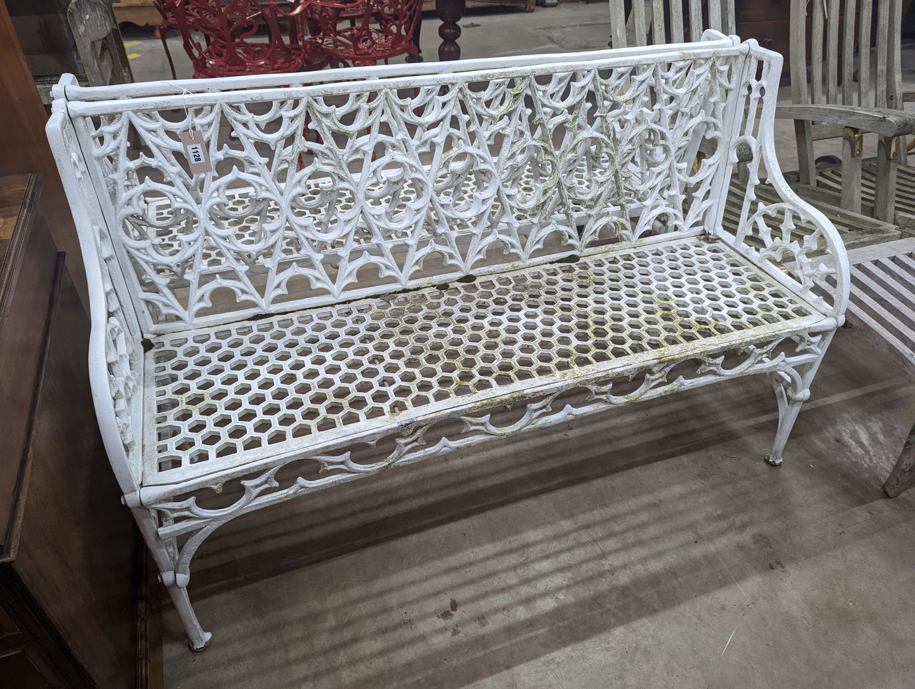 A pair of Victorian style painted cast metal garden benches, length 138cm, depth 44cm, height 86cm